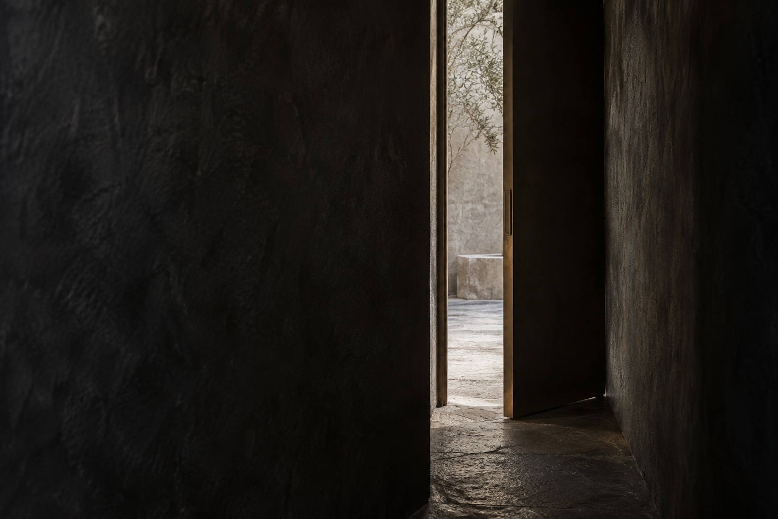 An open dark doorway with a strip of light across the floor.